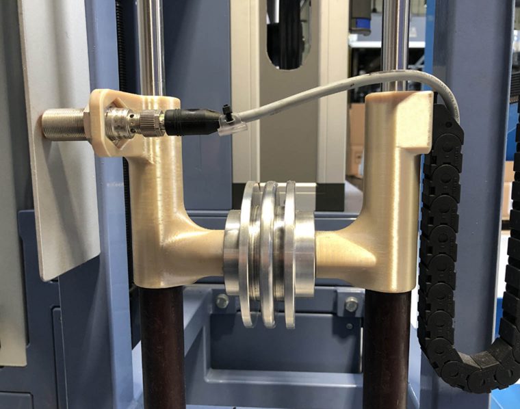 Rustin used its Stratasys Fortus 450mc to create internal production line tooling. The photo above shows the weight optimization tool produced in ULTEM 9085 resin. Photo via Rustin.