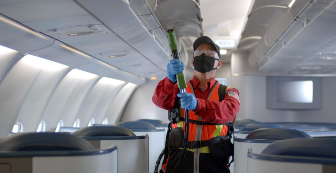 Delta Airline - Staff sanitise the aircraft using disinfectant spray during transit
